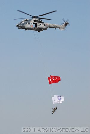 A Cougar helicopter towed two flags; on top was Turkish flag with the 100 year anniversary below it. 